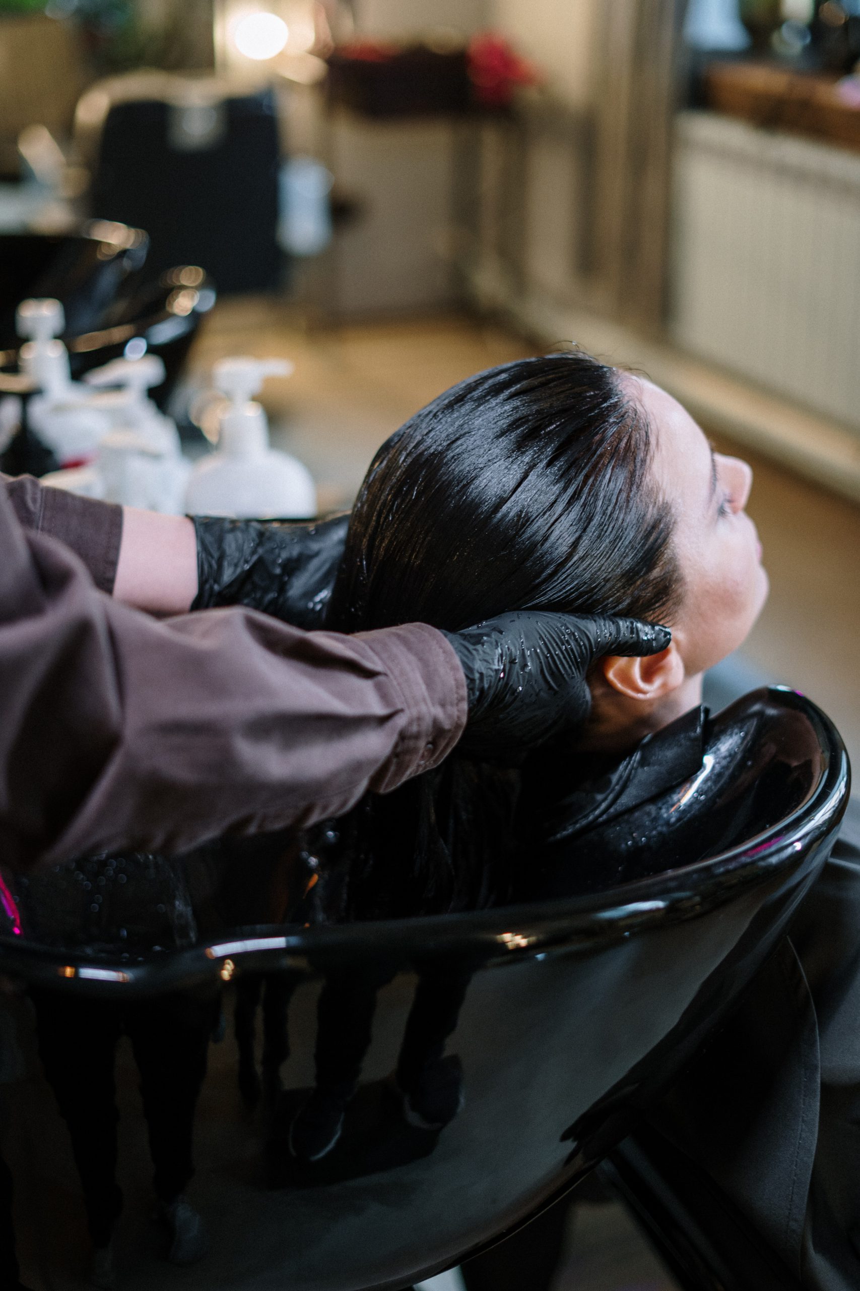 woman get hair washed at salon